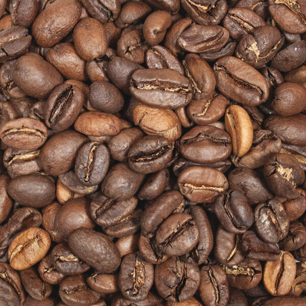 A close up of coffee beans on the ground